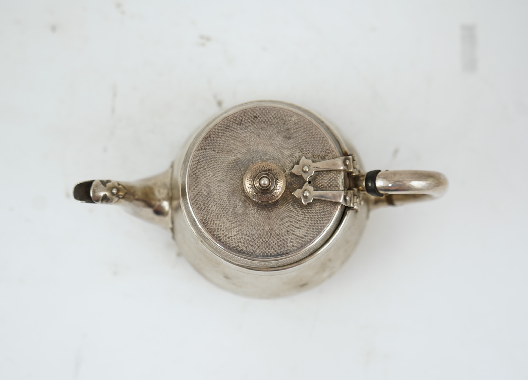 A Victorian engine turned silver teapot by Hunt & Roskell